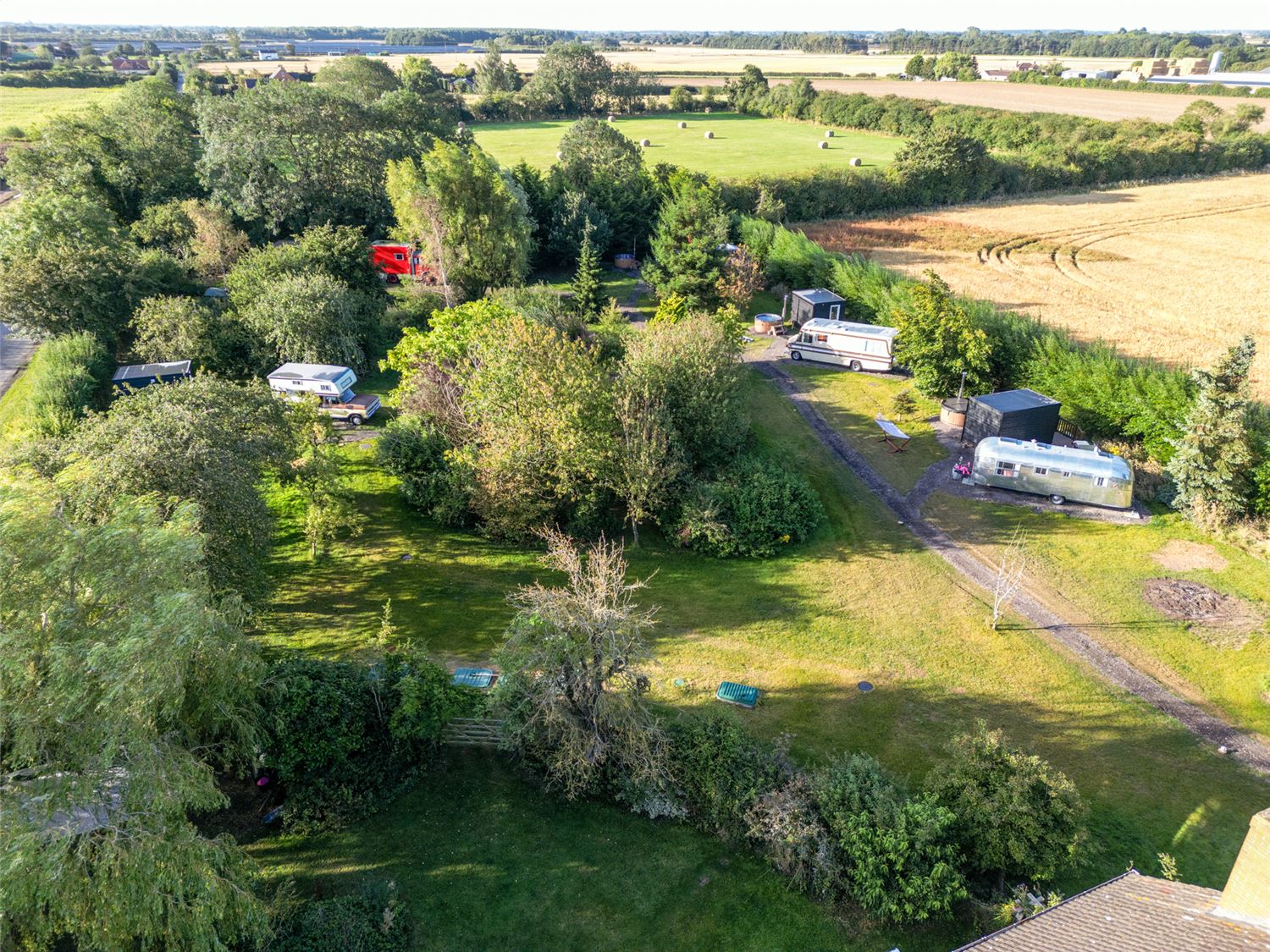 Overhead shot of the Layby Lincs showing the vehicles on the site, surrounded by trees and fields.